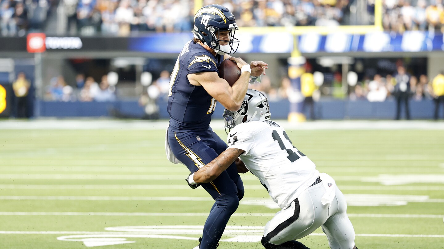 Justin Herbert Questionable to Return After Left Hand Injury in Recent NFL Game